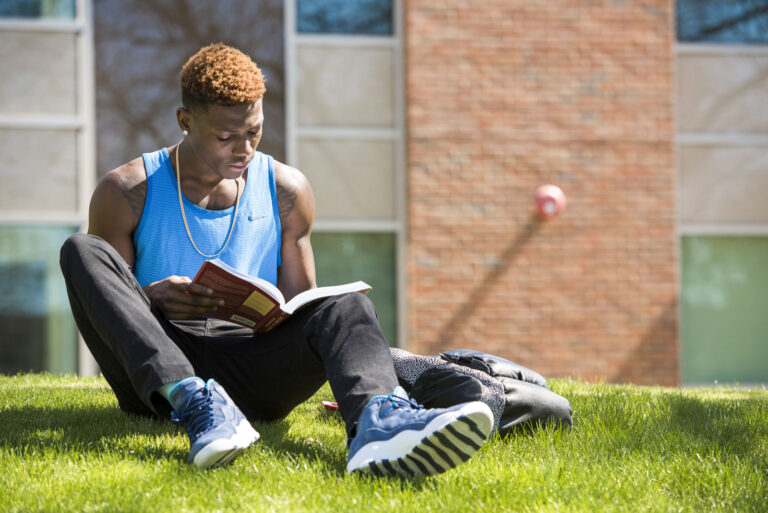 Student studies outdoors