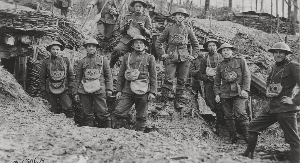 Soldiers wearing gas masks in a trench