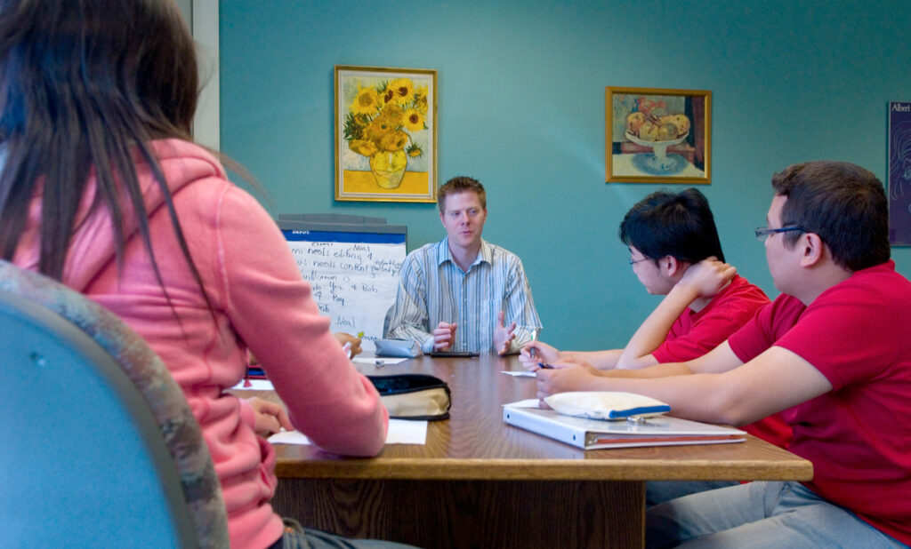 Group of students gathered around a table