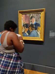 EWU Art History Student viewing a painting