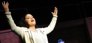 An EWU music student sings in a musical production.