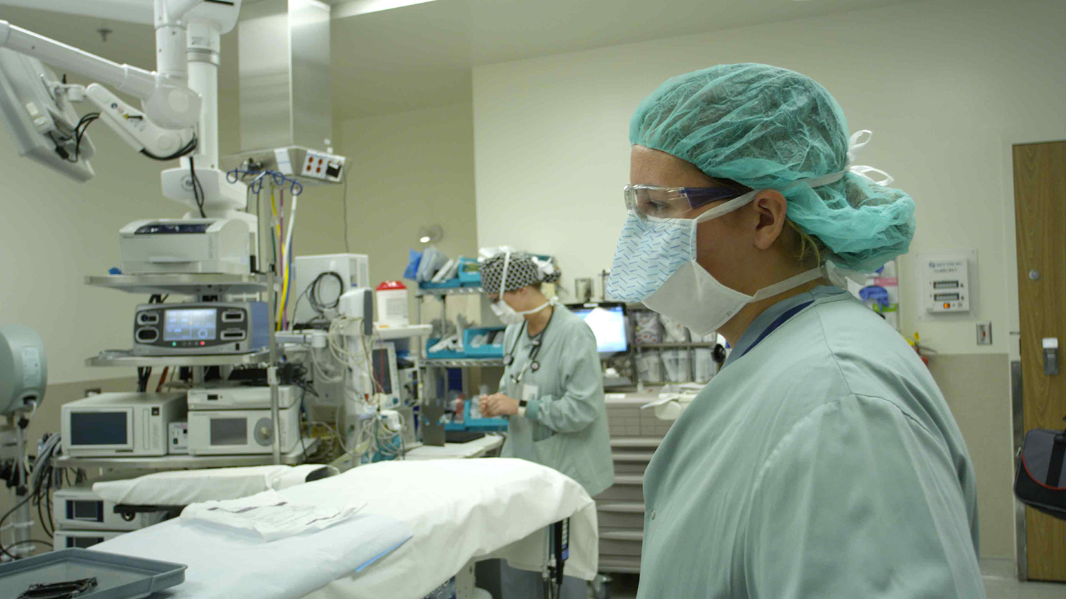 Student in an operating room with a medical professional