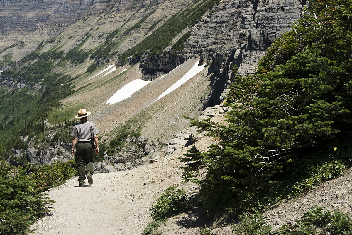 A park ranger walks in the mountains