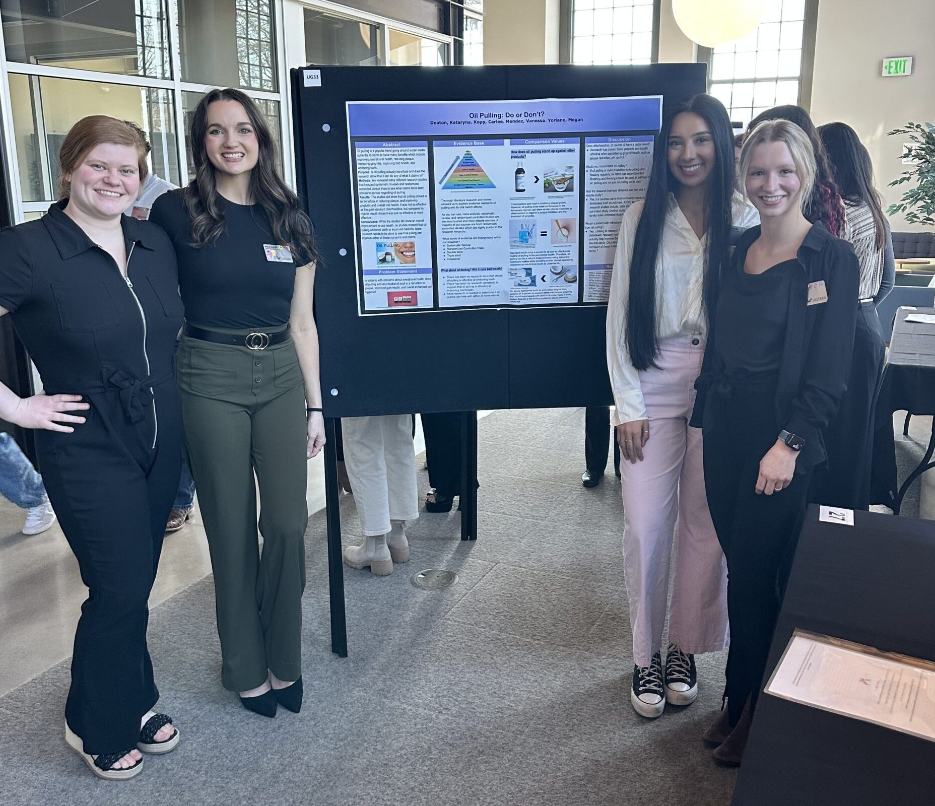 Students standing in front of their winning poster