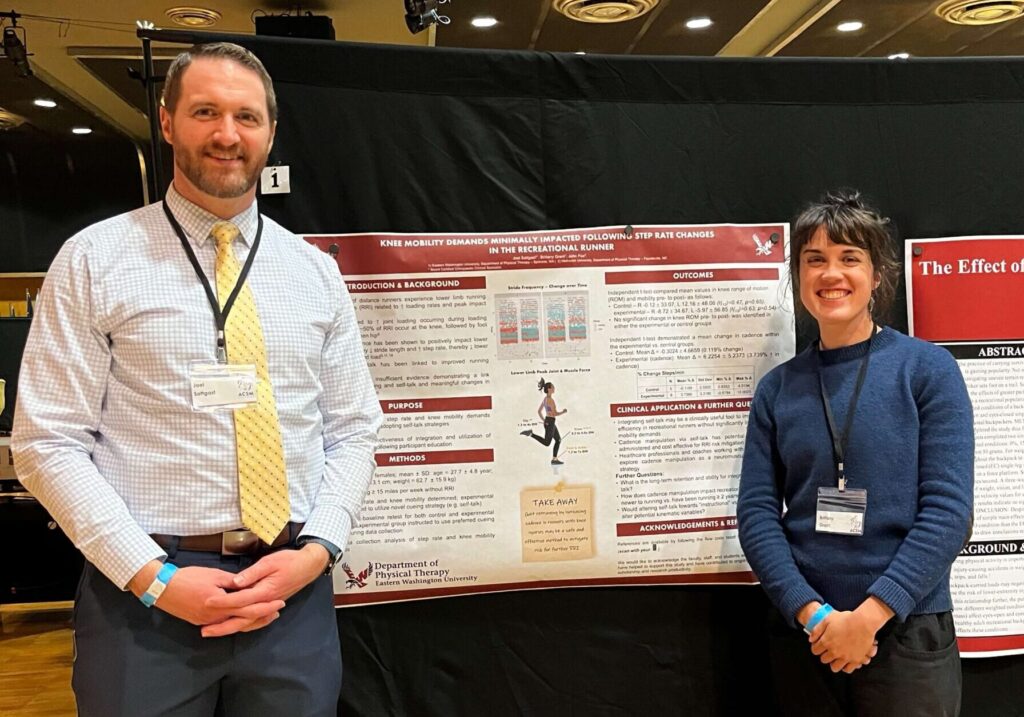 Professor and student in front of presentation.