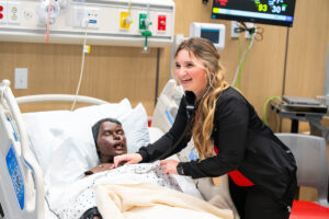 An EWU nursing student practices giving a health assessment