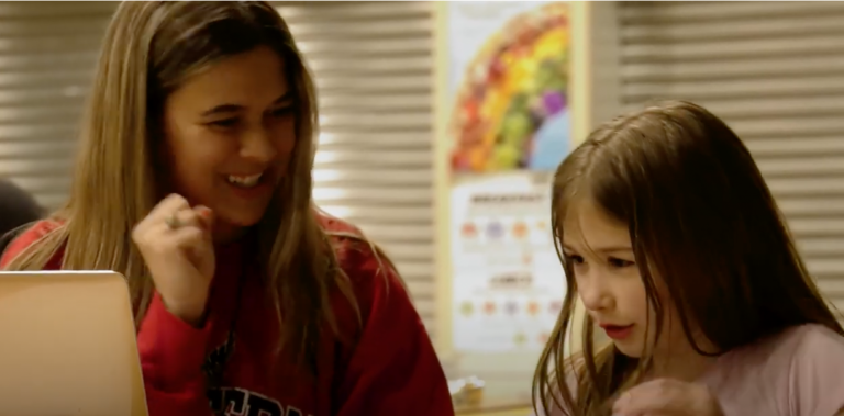 EWU student interacting with young student