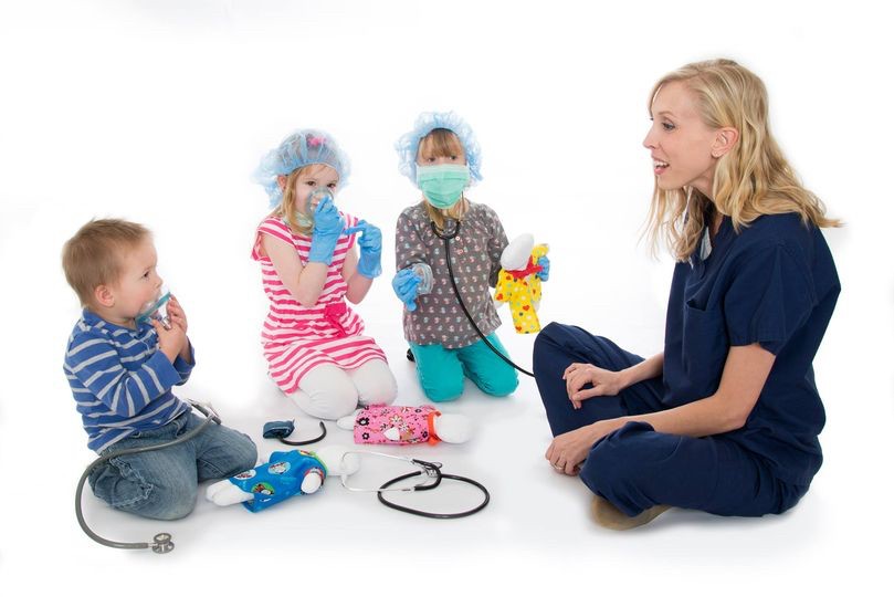 EWU graduate Belinda Thayn, MA, Certified Child Life Specialist, with children at Castleview Hospital