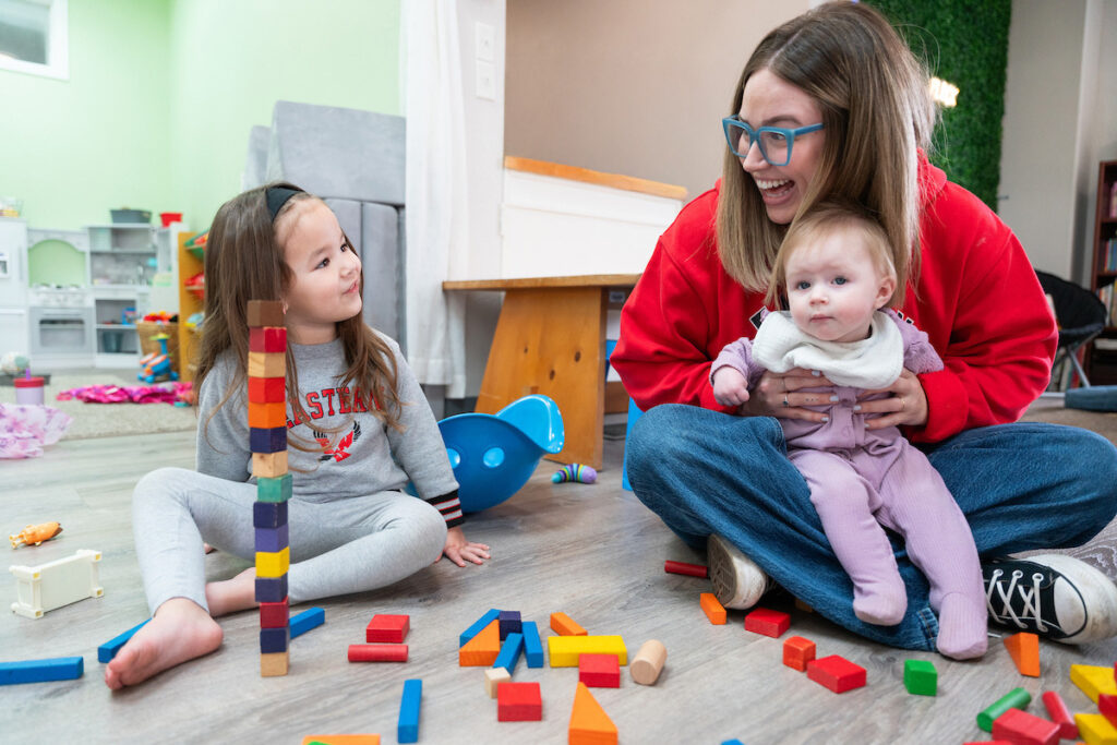 An EWU Children's Studies alumna plays with children at a local preschool