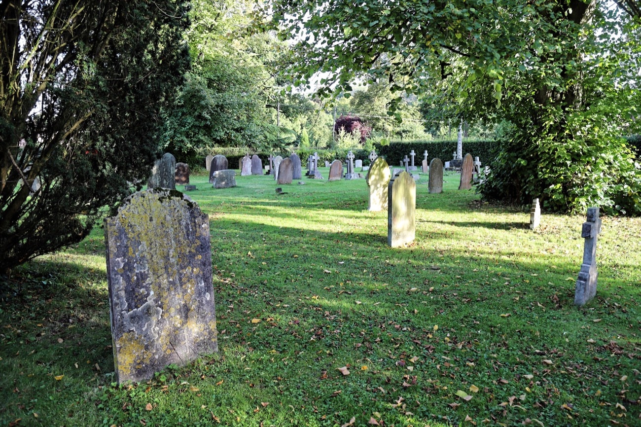 Lichen covered headstones in a cemetery