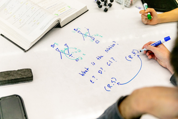 Students work on a physics assignment 