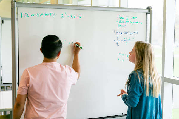 Two students work on a math problem