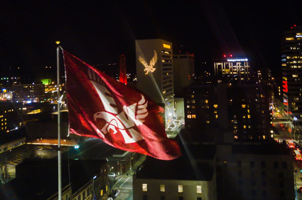 EWU flag flies over Spokane at night