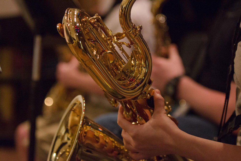 Closeup of someone playing a brass instrument
