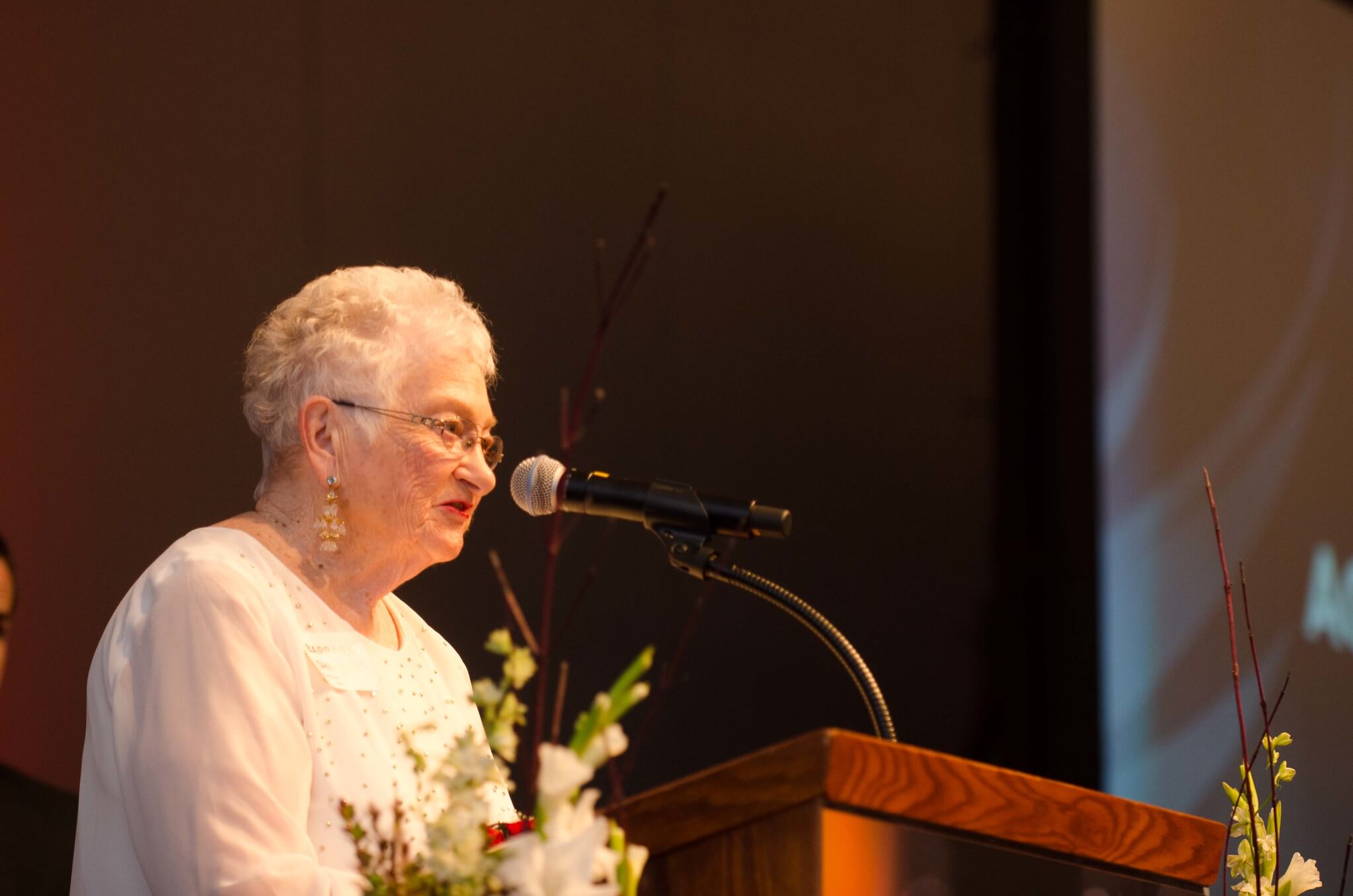 Barbara Shields speaks on a podium