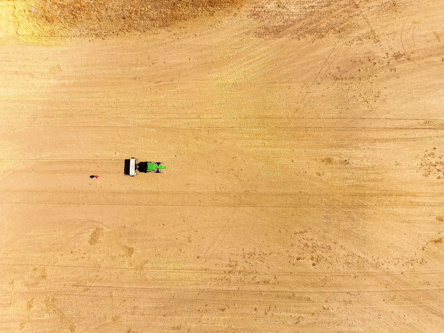 Aerial view of a tractor in a field.