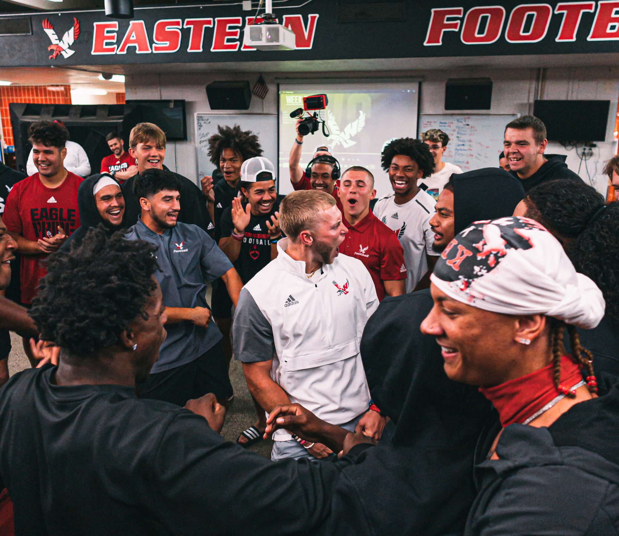 Efton celebrating with his team in the locker room.