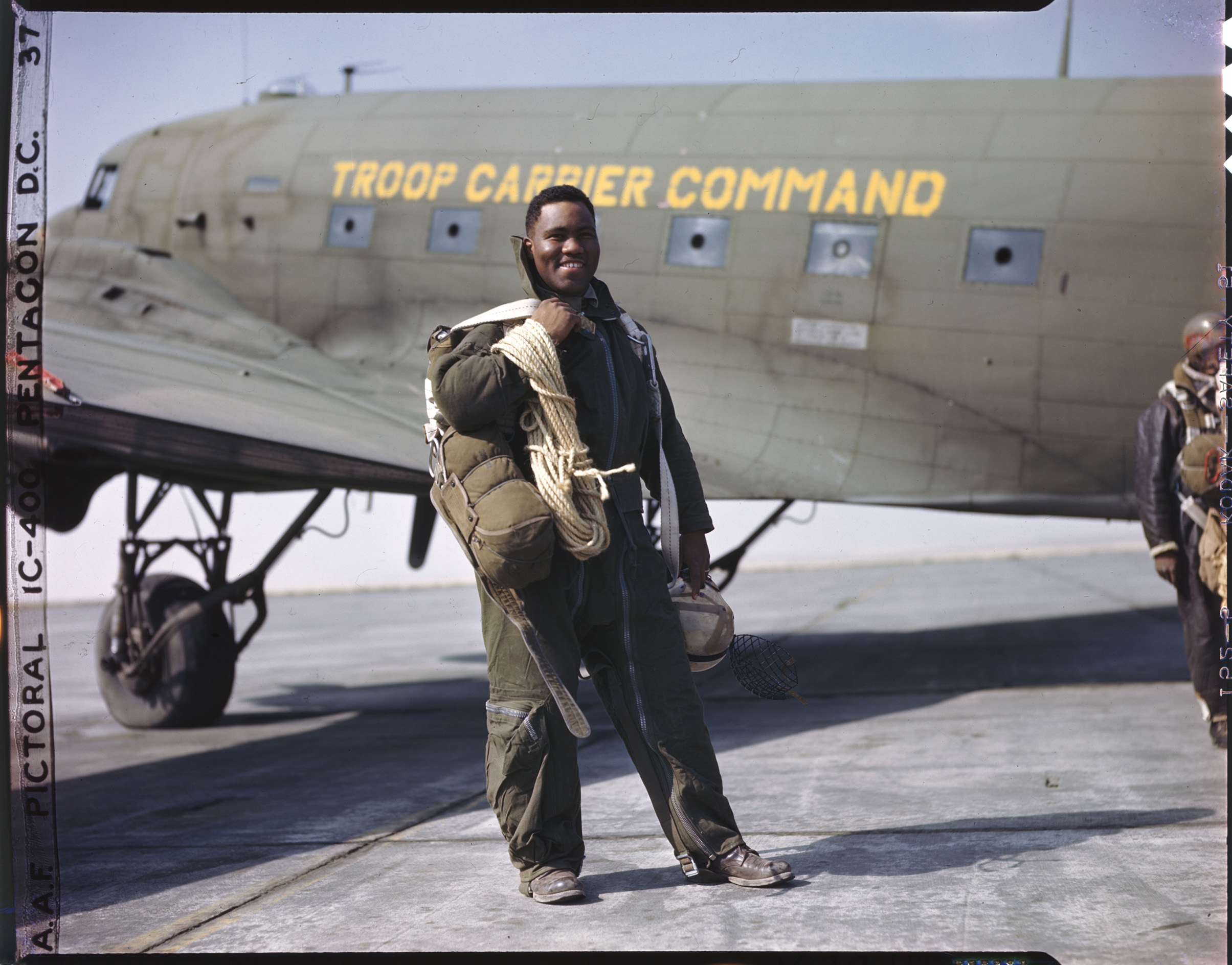Lieutenant Clifford Allen stands in full gear next to his plane