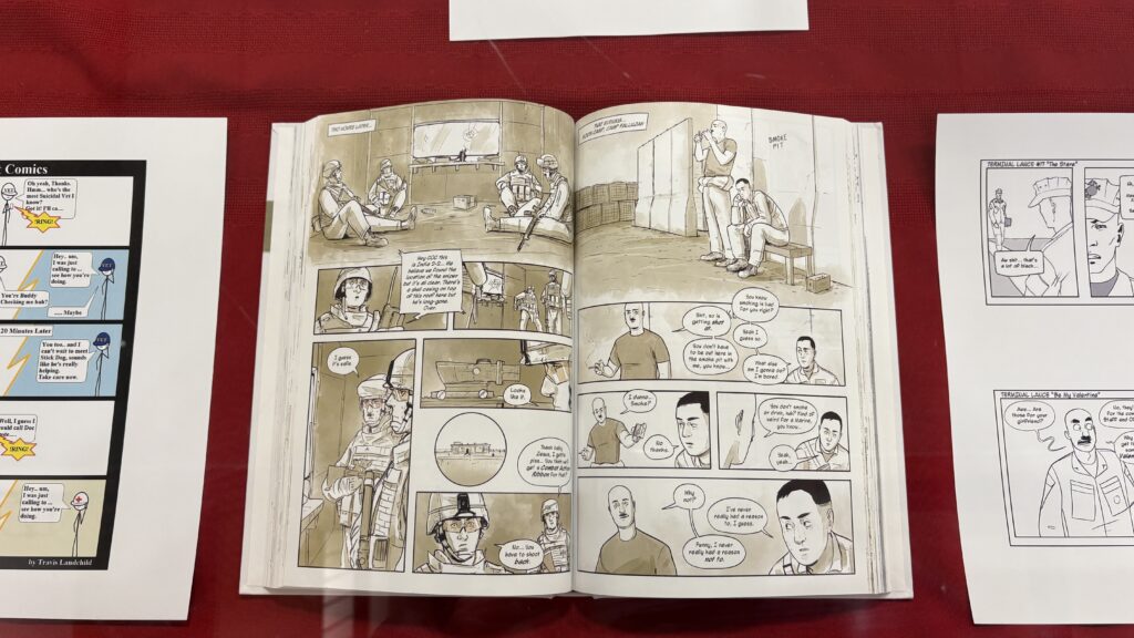 photo of one of the graphic novels in the display case of the Veterans Day display in JFK Library