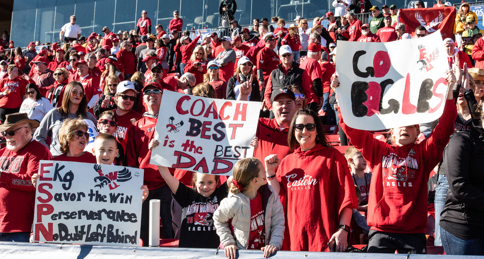 Fans at the National Championship wave signs of support