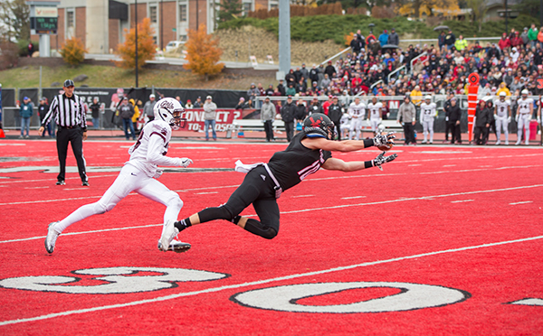 Cooper Kupp catching the football on the red turf