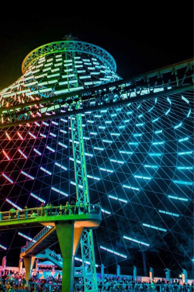 expo pavilion with colorful lighting at night