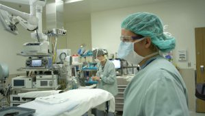 Medical professionals preparing an operating room