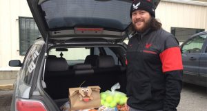 Student with donations in his trunk