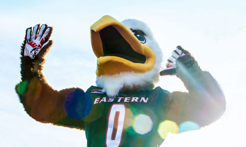 Image of the EWU mascot, Swoop, posing outdoors in the sun.