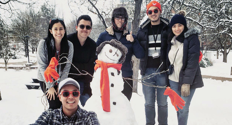 Picture: Students posing around a snowman.