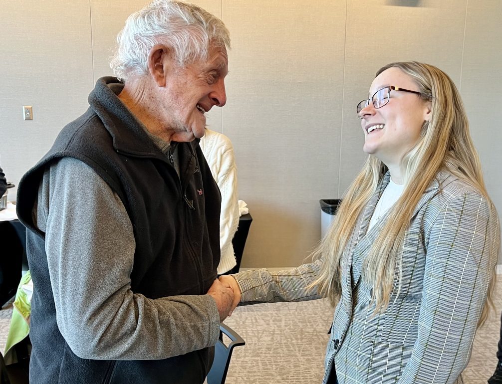 Future math teacher, Jacquelyn Pinkney, a senior, thanked veteran teacher, Wayne Wright, for supporting scholarships and asked for his advice during a recent scholarship reception.
