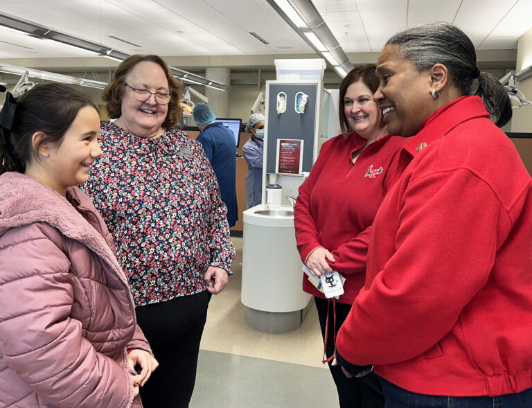 Eva, 9, enjoyed meeting Dawn Lewis-Kinnunen, dean of the College of Health Science and Public Health, Professor Merri Jones and Lorie Speer, associate professor and department chair.