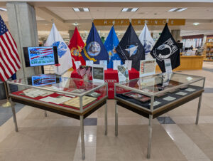 Photo of Memorial Display with flags representing the branches of the military.