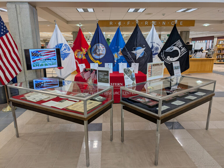 Photo of Memorial Display with flags representing the branches of the military.