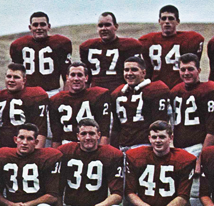 Photo of Bink Wall wearing his #57 uniform, surrounded by other teammates.