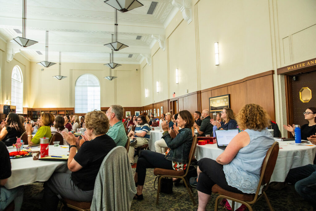 Employees sitting and listening at the event.