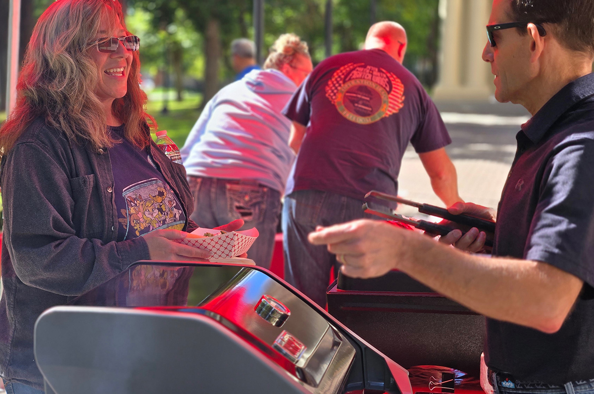 Dave Millet grilling hotdogs at his annual VRC barbecue.