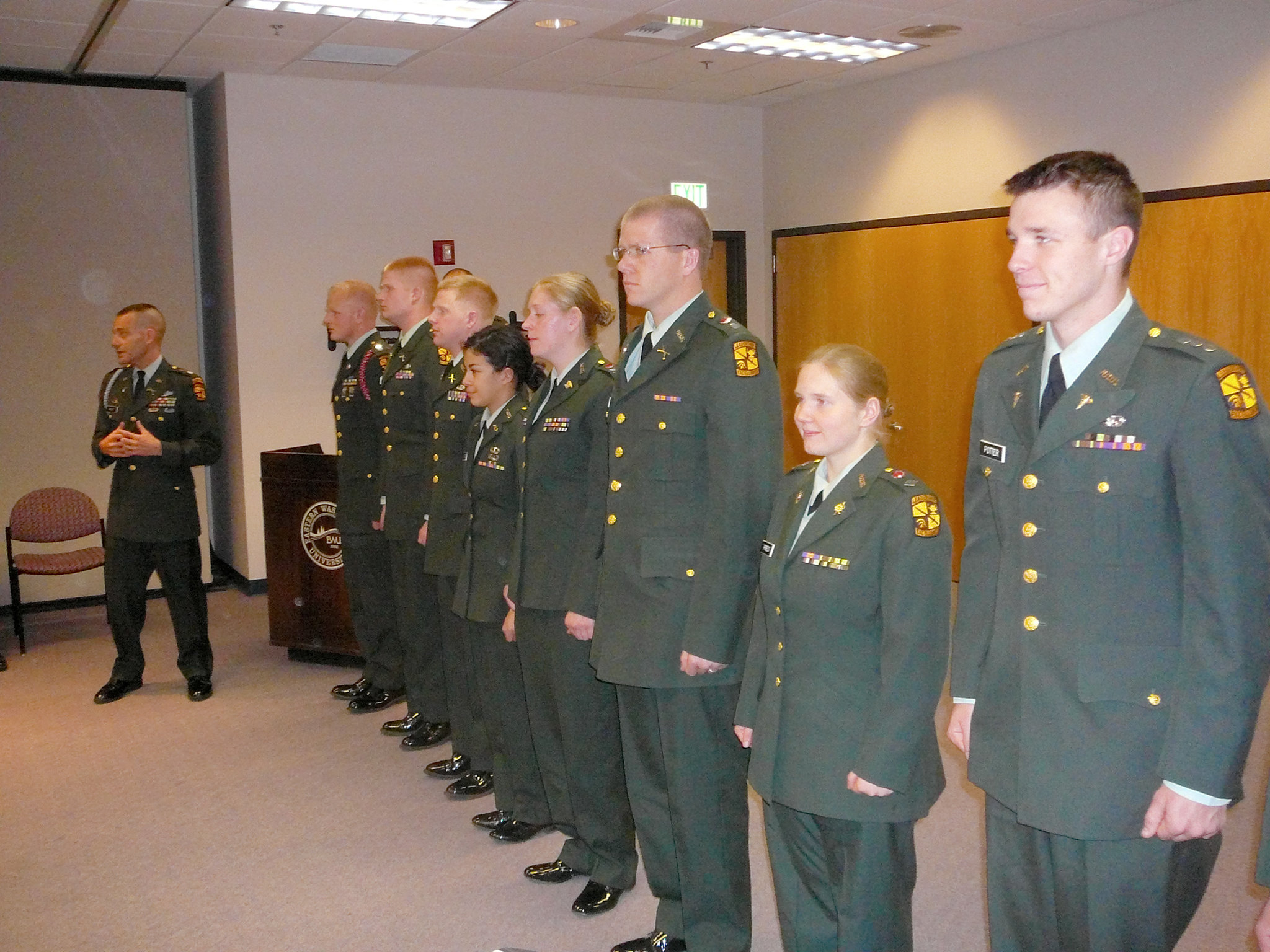Dave Millet teaching ROTC student who are in uniform.