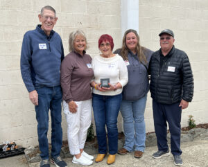 Linda Wall-Sullivan, middle, and her husband, Bill Sullivan, maintain strong relationships with Bink's brother Tom Wall, his wife, Mary Beth and their daughter, Kara.