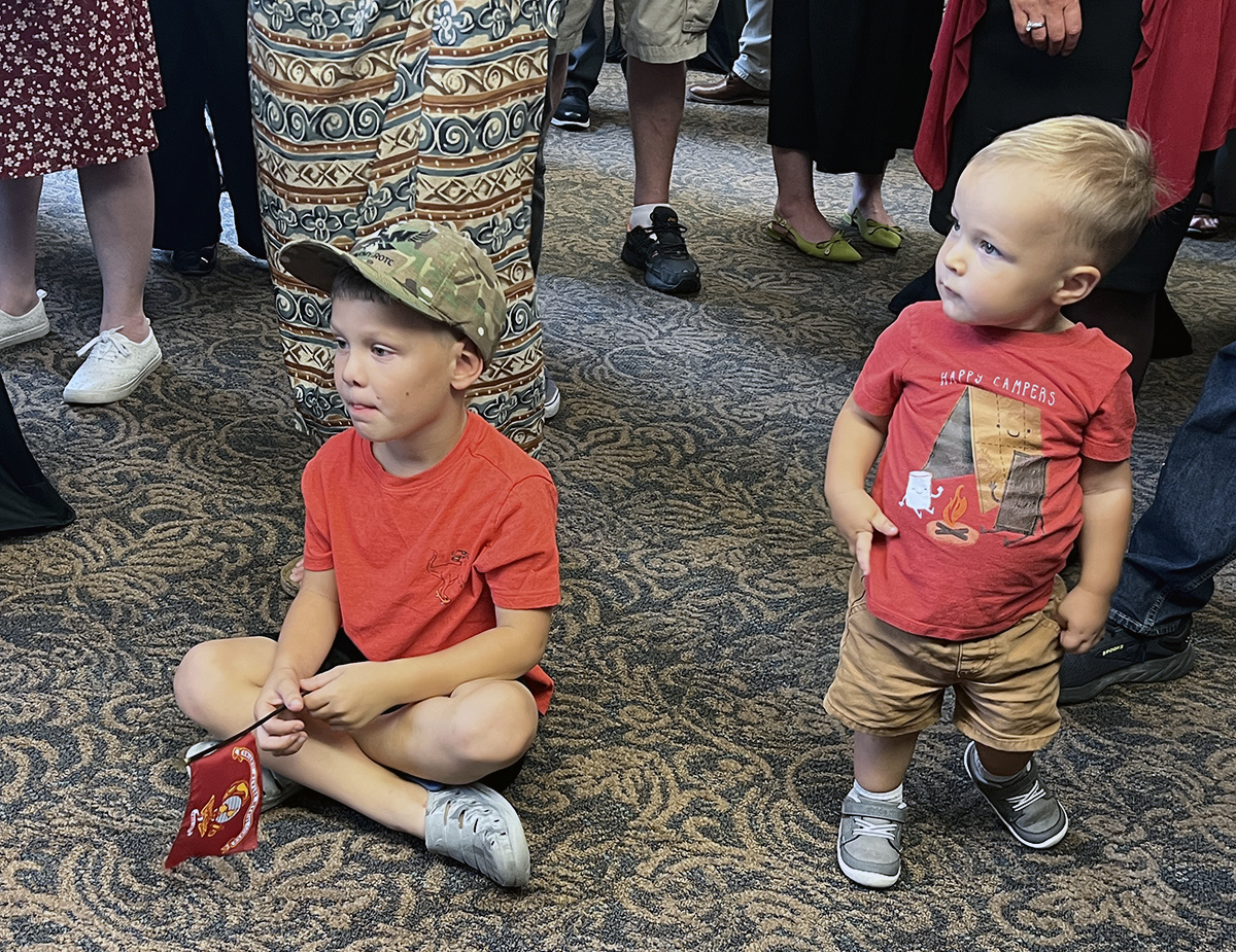 Two of Millet's grandsons sitting on the floor.