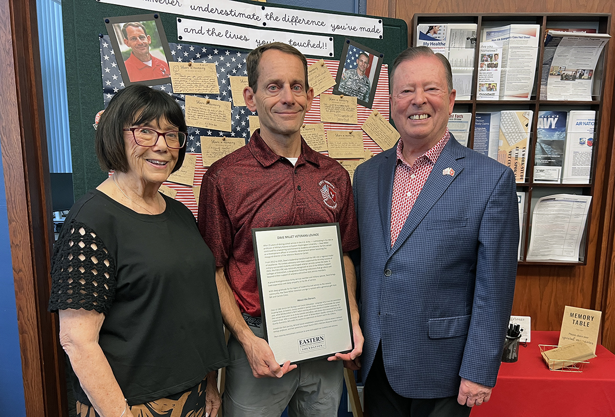 Dave Millet, holding the naming plaque, with Connie and Bill Cross.