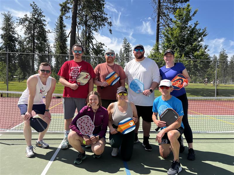 Dave Millet with his EWU pickleball players at a park.