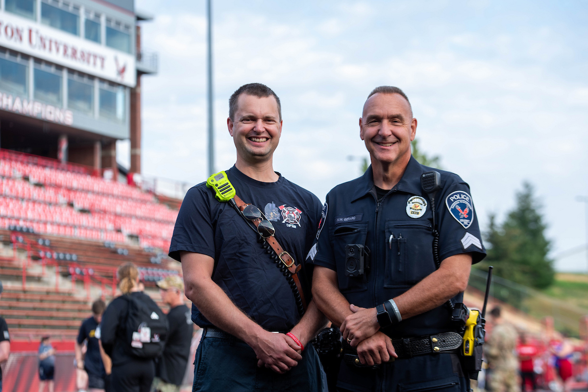 An EWU policeman and Cheney firefighter pose for a photo.