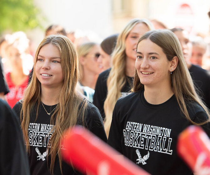 Two new students marching.