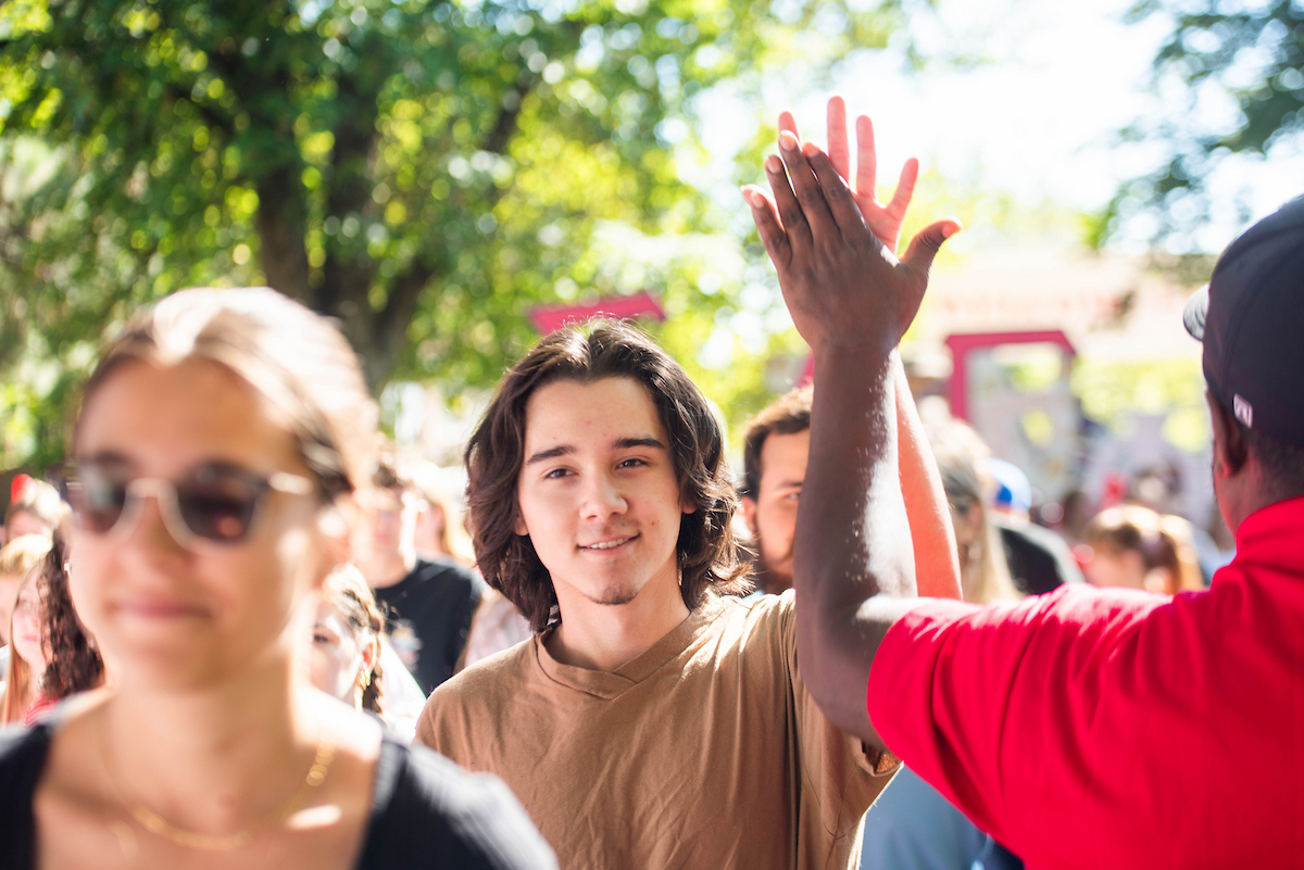 New student getting a high-five.