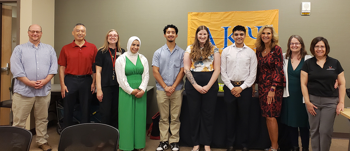 Fraternity group photo with students, advisors and president McMahan.
