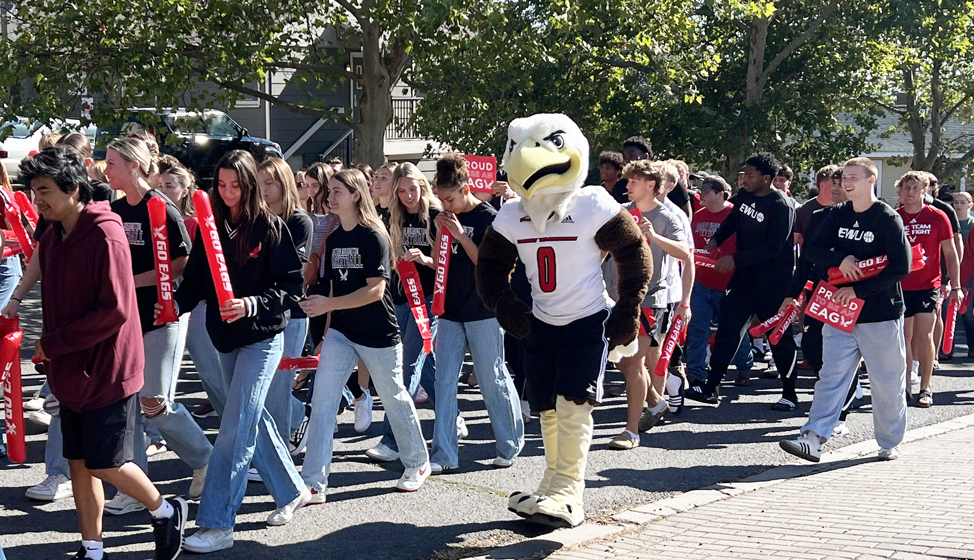 Swoop marching with new students.