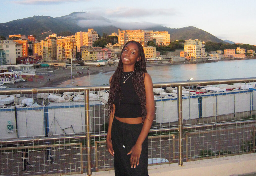 Rama Bah with a cityscape background with a bay and boats.