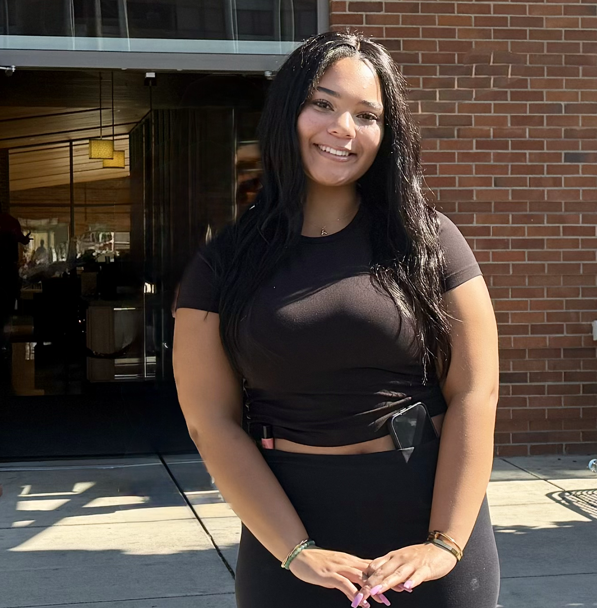 Student standing near snyamncut entrance.