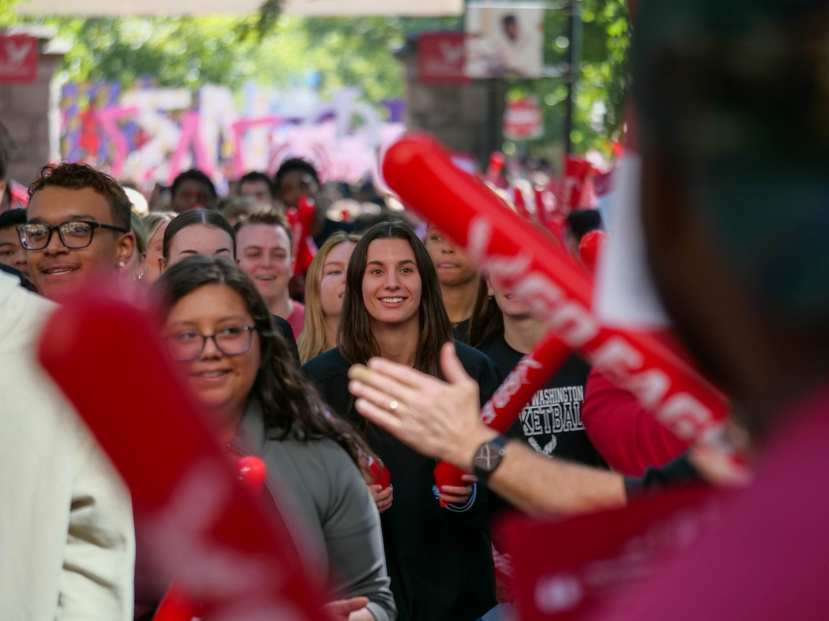 Students passing through the pillars.